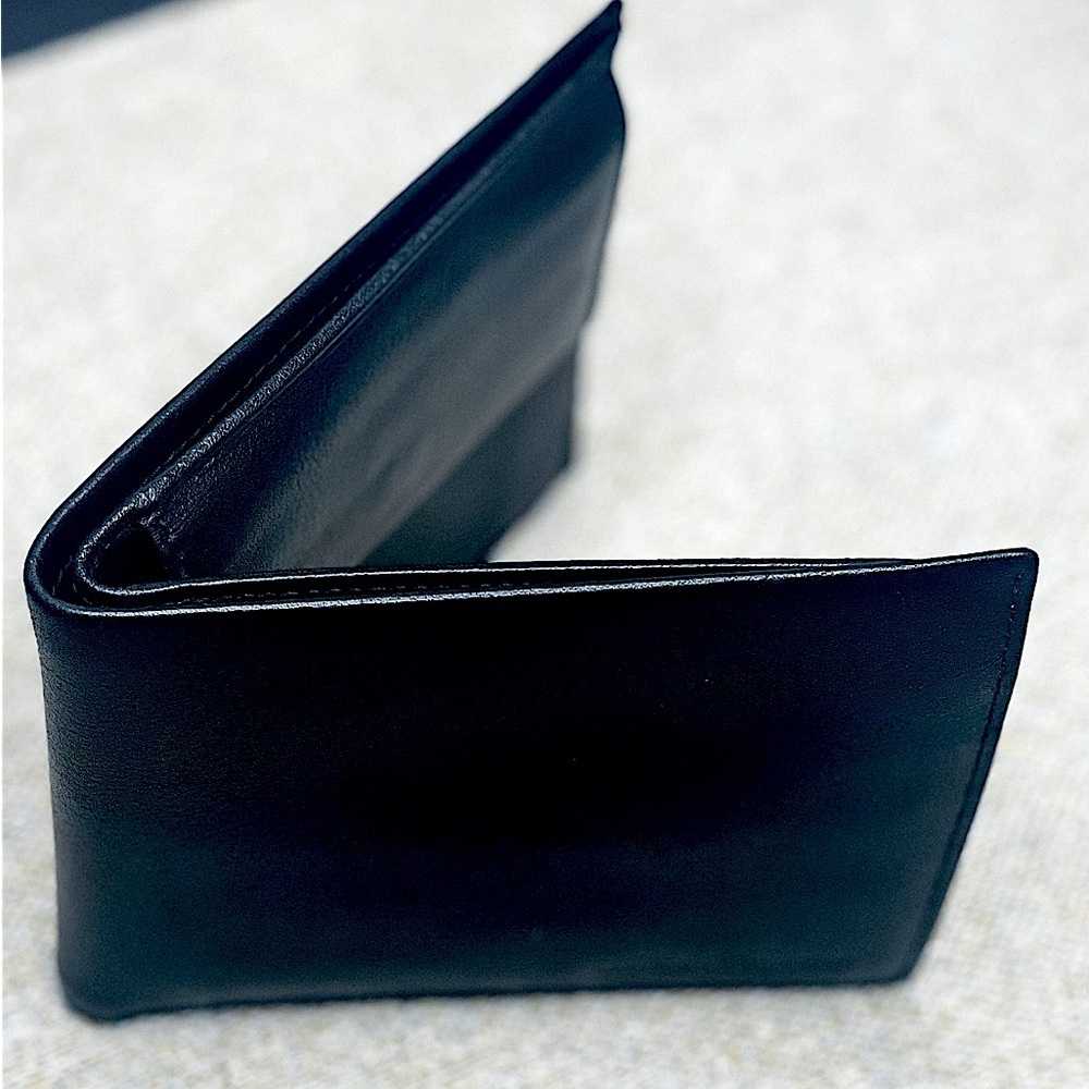 Salvador Ferragamo black bifold wallet.